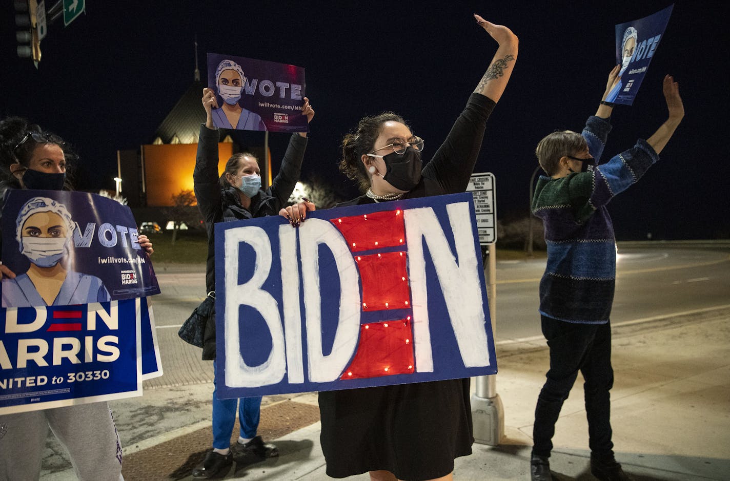 Chancey Willis, dressed as the late Supreme Court Justice Ruth Bader Ginsberg, joined around thirty-five Biden supporters as they gathered at the intersection of Central Entrance and Mesaba Ave. in Duluth on Tuesday evening. ] ALEX KORMANN • alex.kormann@startribune.com A group of around thirty-five Biden supporters gathered at the intersection of Central Entrance and Mesaba Ave. in Duluth on Tuesday evening. The group was met with a near constant stream of approving honks. When the occasional T