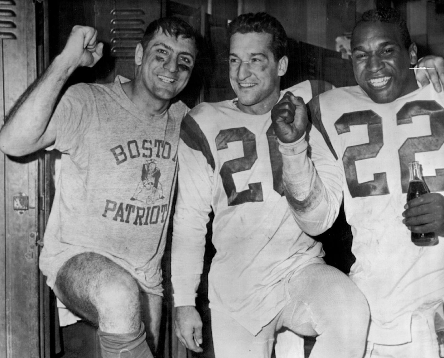 December 29, 1963: Happy Patriots (l-r) Babe Parlli, Geno Cappelletti and Ron Burton celebrate East title.