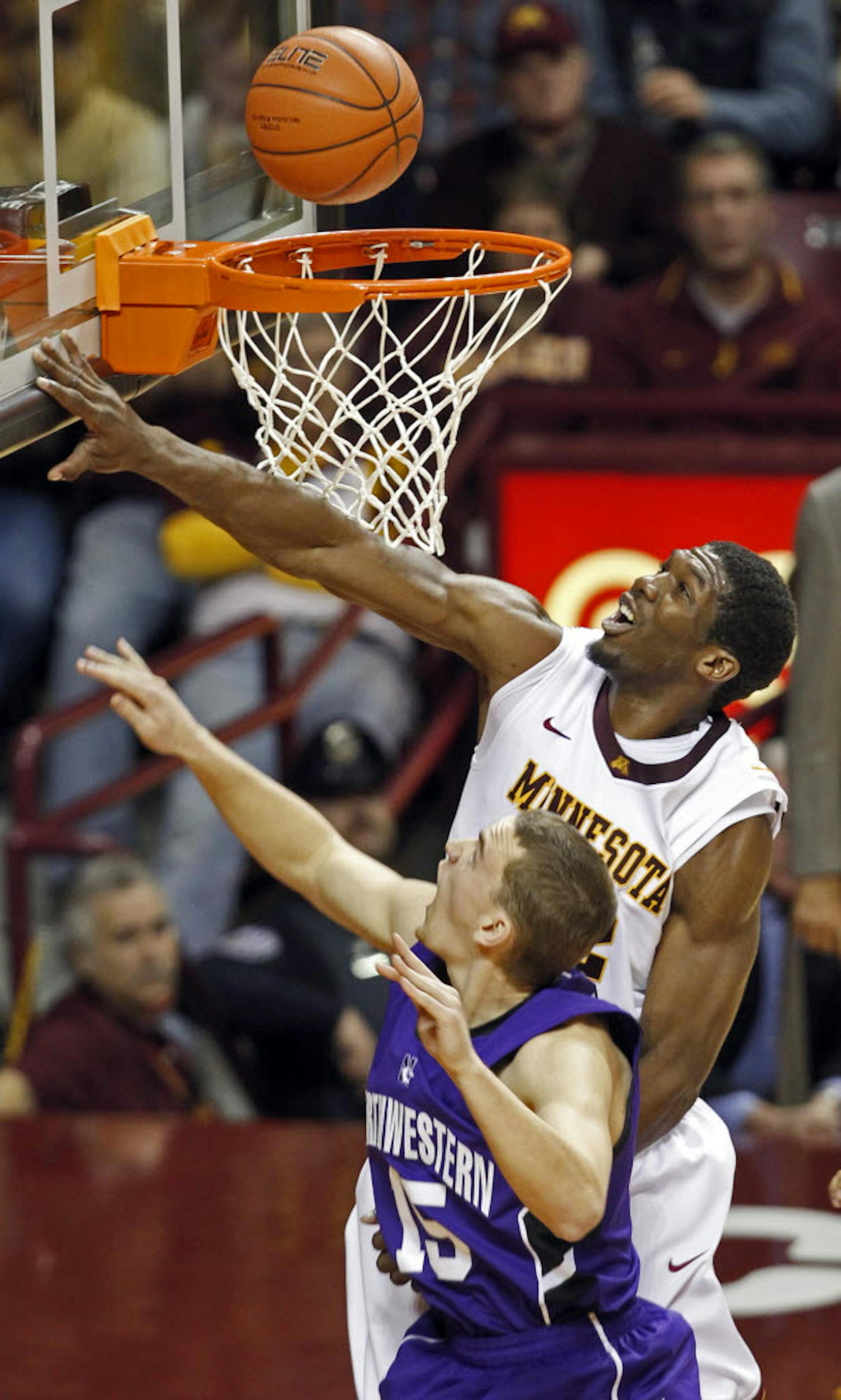 Forward Trevor Mbakwe swatted the shot of Northwestern's Nick Fruendt, asserting the Gophers' strength inside.