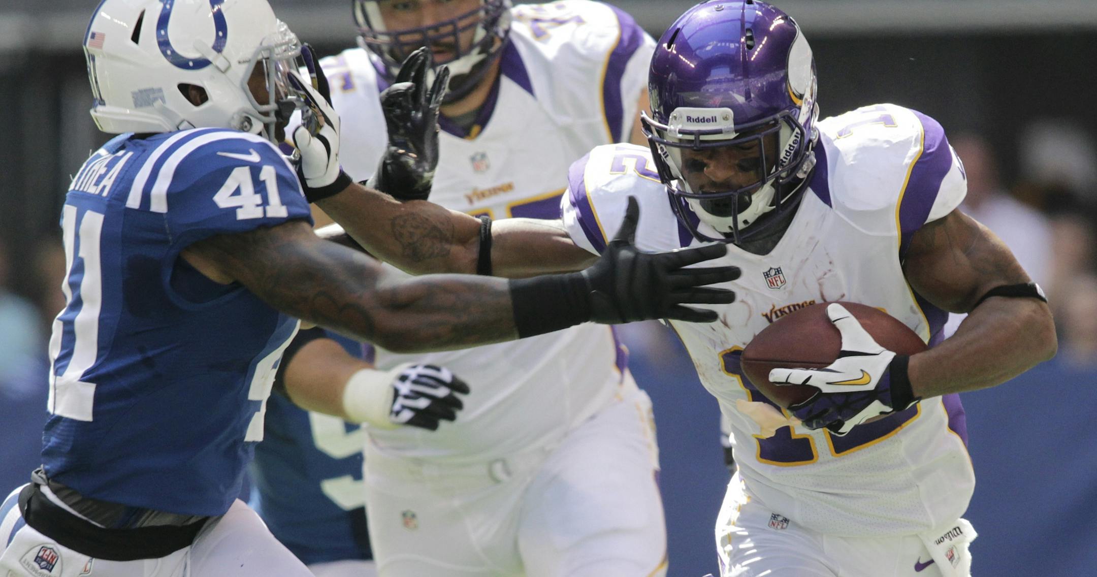 Minnesota Vikings' Percy Harvin runs against Indianapolis Colts' Antoine Bethea during the first half of an NFL football game in Indianapolis, Sunday, Sept. 16, 2012.