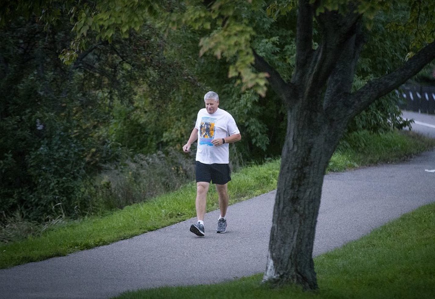 Mick Stephens made his way around Lake of the Isles during a morning run, Thursday, September 27, 2018 in Minneapolis, MN. Stephens, a long-time marathoner, had both knees replaced and is back on the road running.