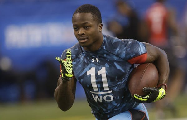 Texas receiver Marquise Goodwin runs a drill during the NFL football scouting combine in Indianapolis, Sunday, Feb. 24, 2013.