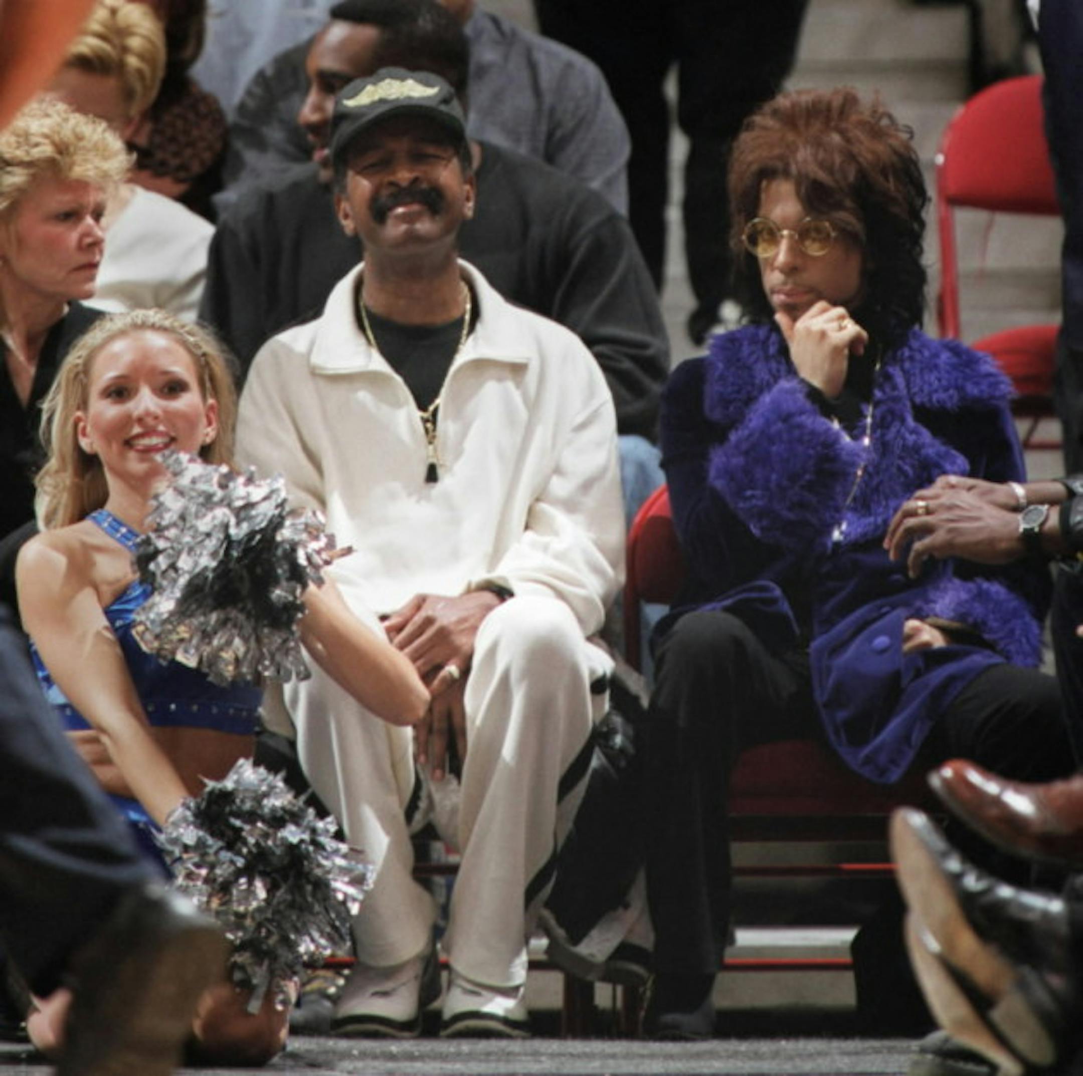 Prince showing his purple pride at a T'Wolves game with Larry Graham in 2000./ Star Tribune file photo