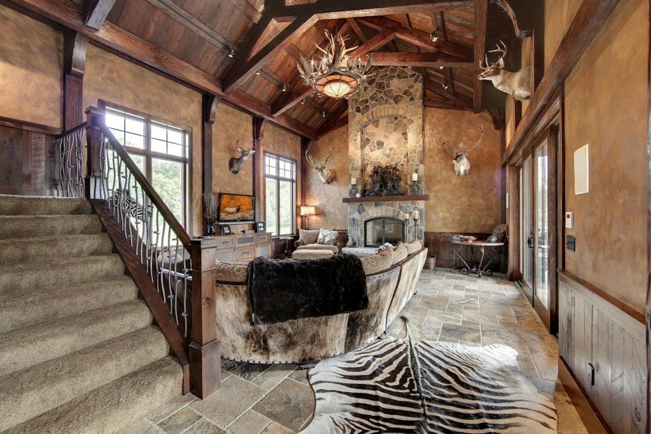 The poolhouse was designed to have a more rustic aesthetic than the main house.