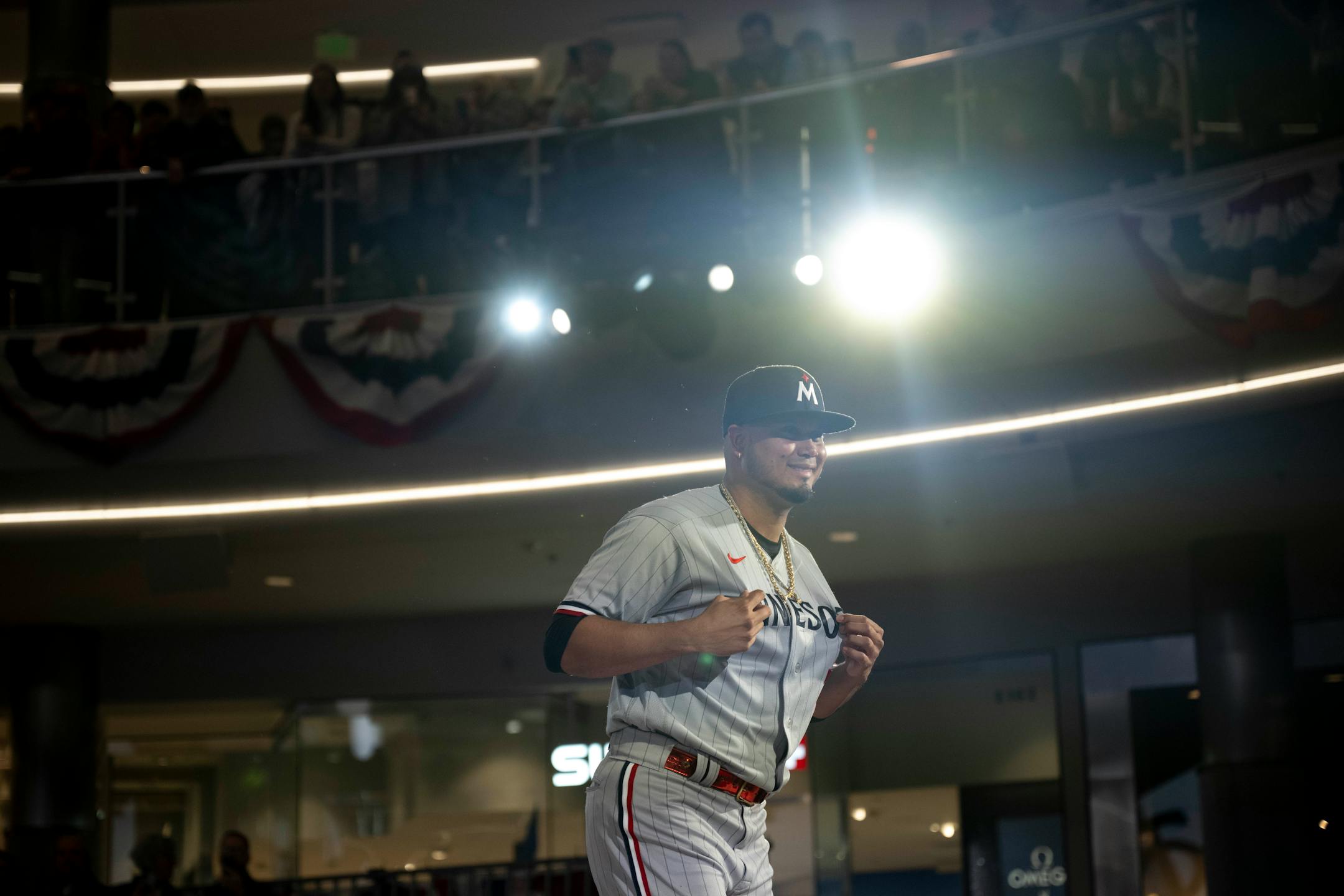 Minnesota Twins first baseman Luis Arraez (2) models a new Twins jersey.