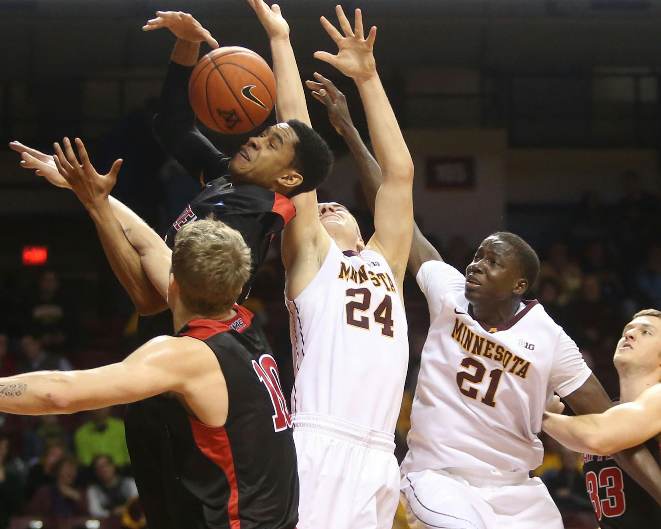 The University of Minnesota's Joey King (24) and Karary Konate (21) battle Seattle University players for a rebound during the first half Friday Dec. 19, 2014, at Williams Arena on the University of Minnesota campus in Minneapolis, MN. The Gophers beat Seattle University 92-57.](DAVID JOLES/STARTRIBUNE)djoles@startribune.com The University of Minnesota Gophers vs. Seattle University, Friday Dec. 19, 2014, at Williams Arena on the University of Minnesota campus in Minneapolis, MN.