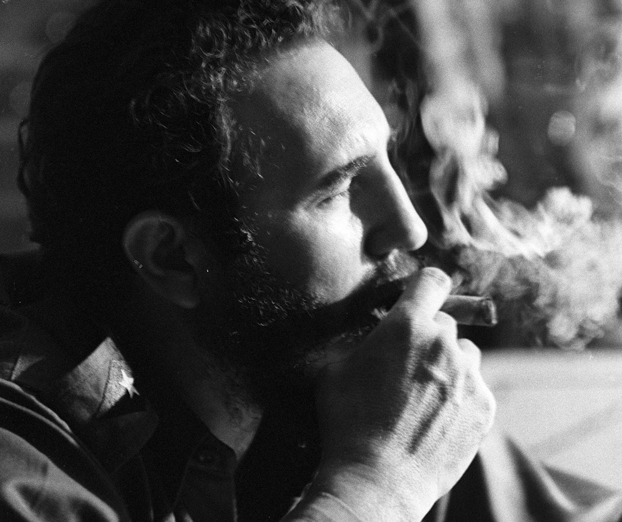 FILE -- Fidel Castro in 1964 with his trademark cigar during an interview in one of his Havana apartments. Fidel Castro who ruled Cuba for nearly half a century, died Friday, Nov. 26, 2016. He was 90. (Jack Manning/The New York Times)