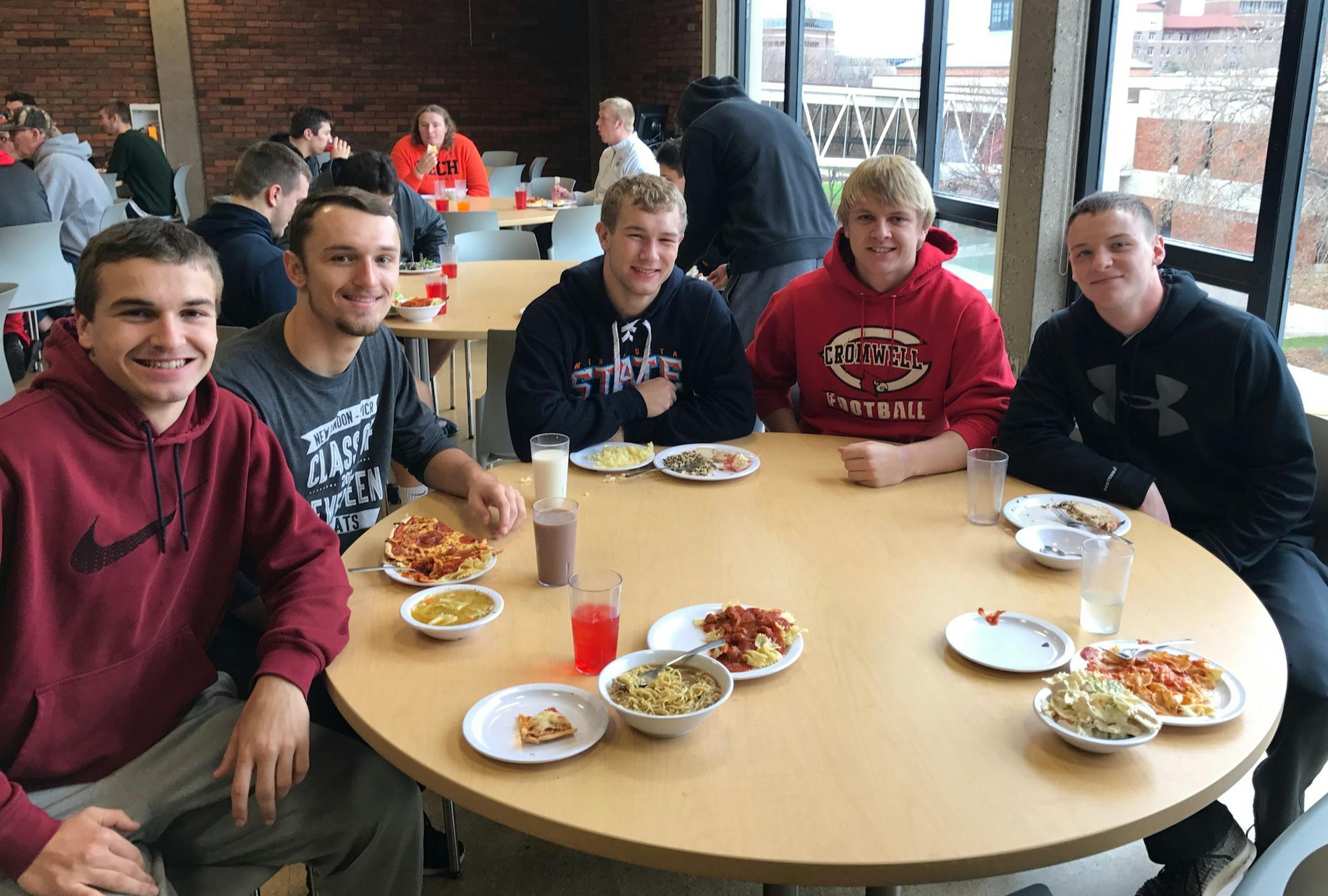 North All-Star football players paused for lunch this week at Augsburg.