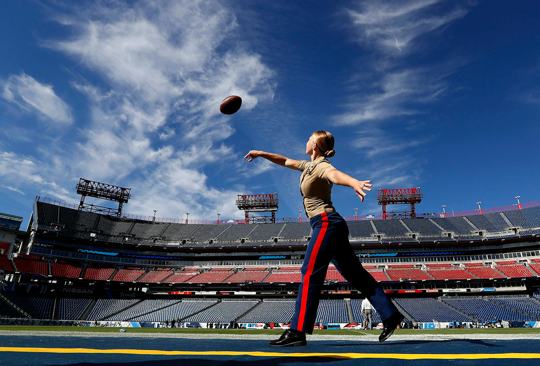 Marine Corps Captain Skye Martin played catch at Nissan Stadium before Sunday's game between Minnesota Vikings and Tennessee Titans.