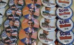 Election buttons of Republicans Scott Walker, Mike Huckabee and Ted Cruz are offered for sale at the Iowa Faith & Freedom 15th Annual Spring Kick Off,