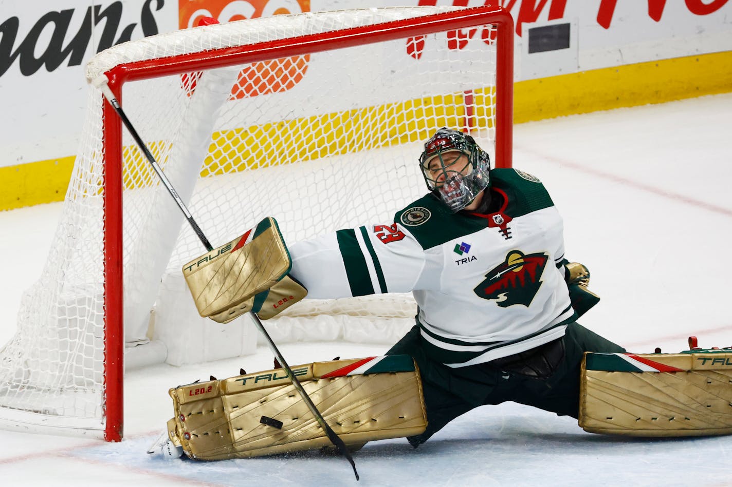 Minnesota Wild goaltender Marc-Andre Fleury (29) sprawls to make a pad-save during the overtime period of an NHL hockey game against the Buffalo Sabres, Saturday, Jan. 7, 2023, in Buffalo, N.Y. (AP Photo/Jeffrey T. Barnes)