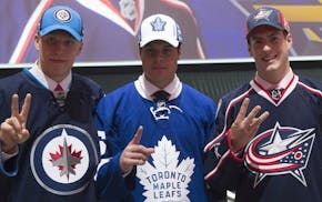 From the left, the top three NHL draft picks: Patrik Laine, Winnipeg Jets (second overall); Auston Matthews, Toronto Maple Leafs (first); and Pierre-L