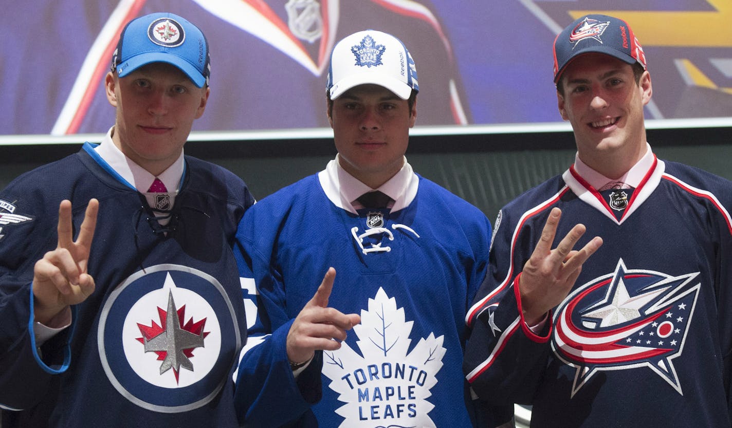 From the left, the top three NHL draft picks: Patrik Laine, Winnipeg Jets (second overall); Auston Matthews, Toronto Maple Leafs (first); and Pierre-Luc Dubois, Columbus Blue Jackets (third).