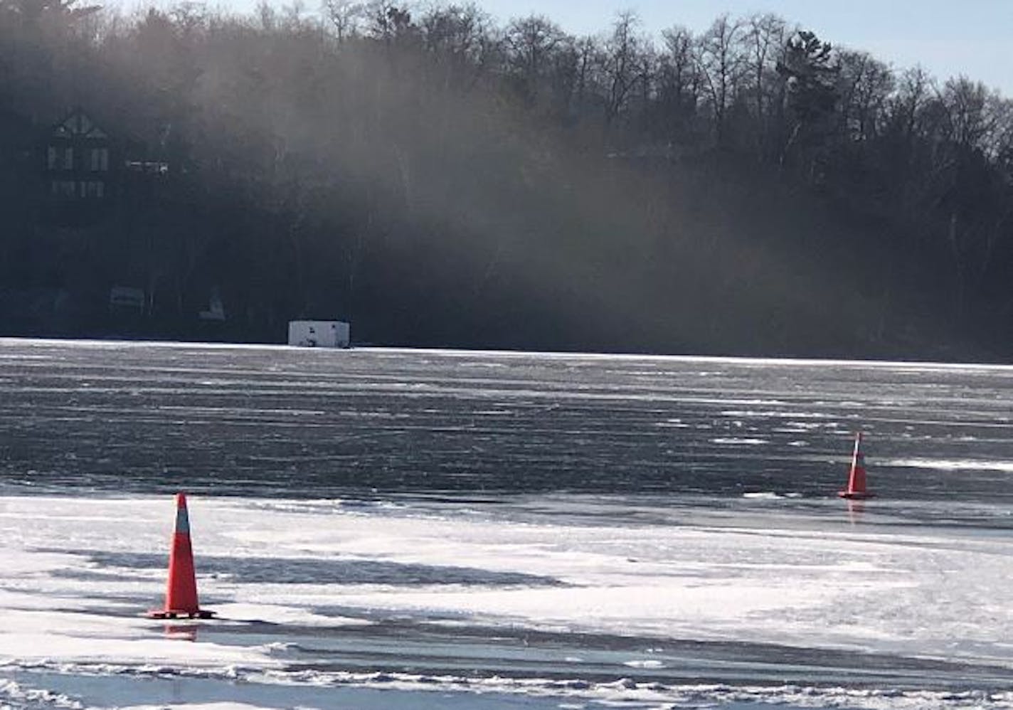 Cones mark the area on the ice where two men died while out fishing on a Morrison County lake.