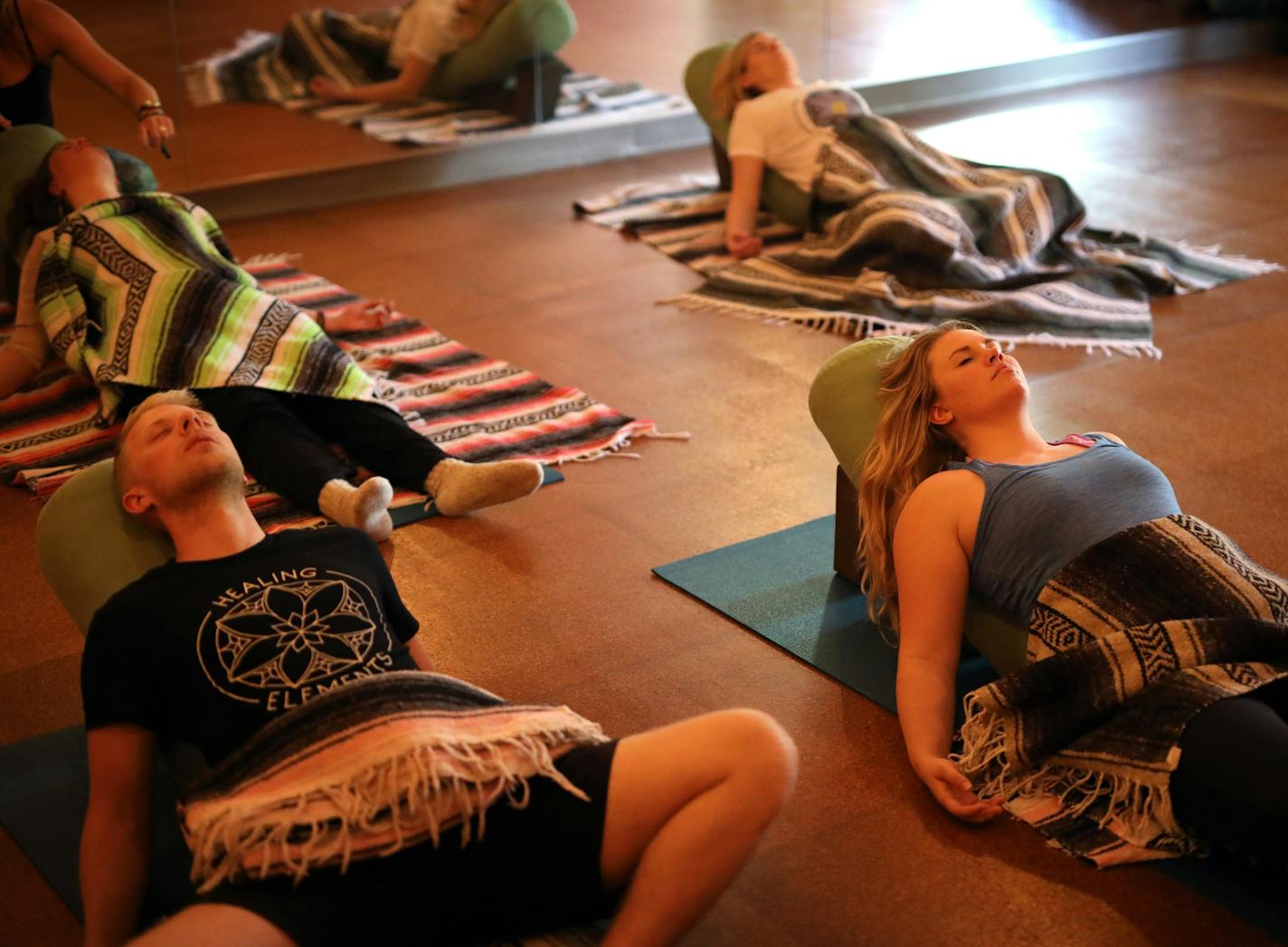 The art of deep relaxation is growing, popping up in yoga studios and some hospitals. At left, Matt and Paige Wildenauer at Healing Elements in St. Paul.