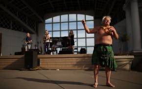 Duane Opitz of Golden Valley danced to the music of All These Islands on perfect summer evening Monday.