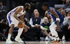 76ers guard James Harden is defended by Timberwolves forward Anthony Edwards during the first half Friday in Minneapolis.