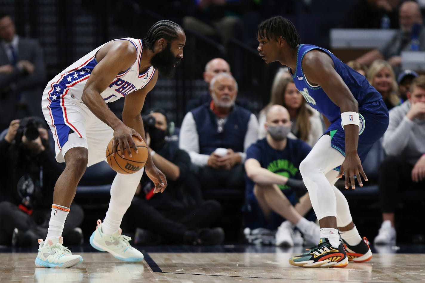 76ers guard James Harden is defended by Timberwolves forward Anthony Edwards during the first half Friday in Minneapolis.