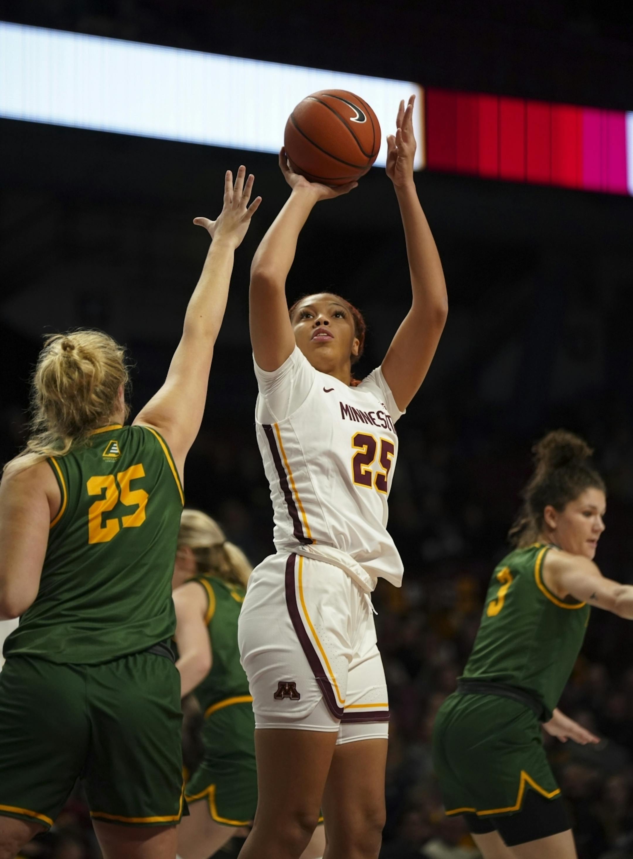 Minnesota Golden Gophers center Klarke Sconiers (25) shot over Vermont Catamounts forward Abby Settelmeyer (25) in the fourth quarter.