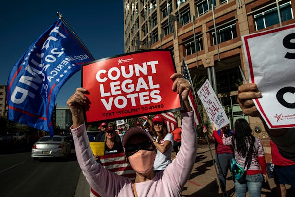 FILE Ñ Supporters of then-President Donald Trump protest in Phoenix on Nov. 5, 2020, two days after Election Day. Arizona was one of the states targe