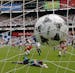 Italy's goalie Luca Marchegiani lies on the grass after Mexico's Marcelino Bernal, left of ball, blasted the ball into the net during the Italy and Me