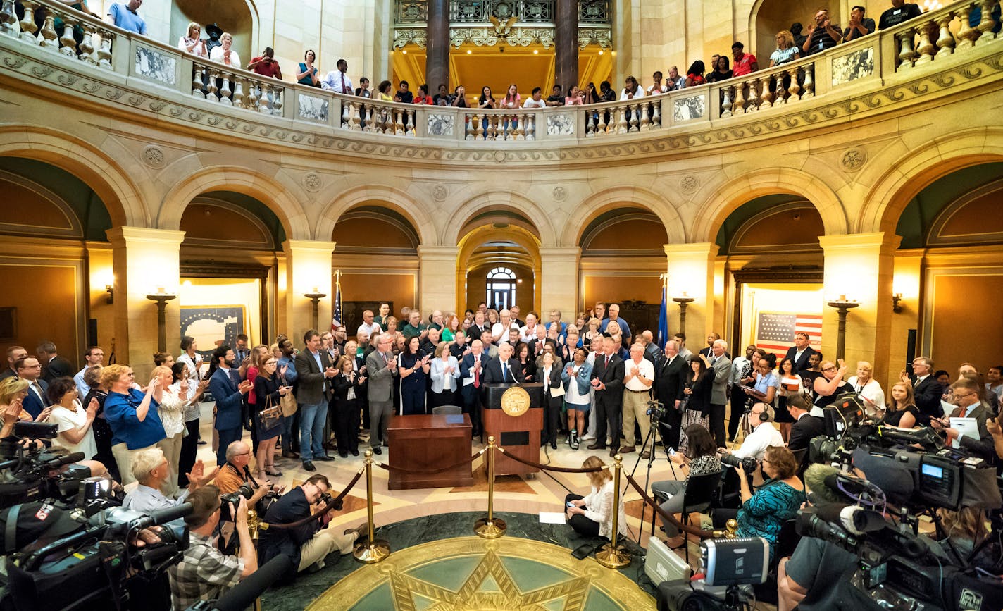 Surrounded by commissioners, legislators, workers, and retirees in the Capitol Rotunda, Gov. Mark Dayton signed the pension bill into law Thursday. The legislation reduces the state's pension fund liabilities and alleviates public workers' and retirees' fears that the retirement fund could eventually run short, which would hurt hundreds of thousands of Minnesotans. ] GLEN STUBBE &#xef; glen.stubbe@startribune.com Thursday, May 31, 2018 Surrounded by commissioners, legislators, workers, and retir