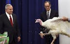 Minnesota Gov. Mark Dayton, left, and Agriculture Commissioner Dave Frederickson, center, kick off Thanksgiving week Monday, Nov. 23, 2015, with an ap
