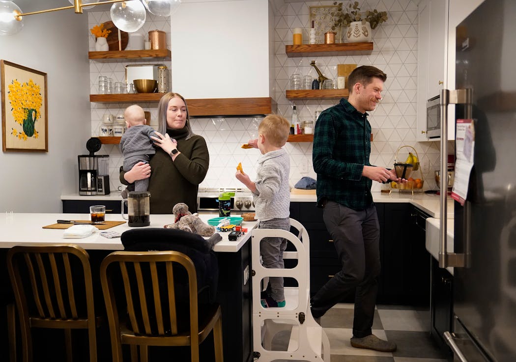 Kelsey and Christian Dahlager ate breakfast with their two children — Wyn, 3, and Day, 8 months — before taking the children to child care in St. Paul.