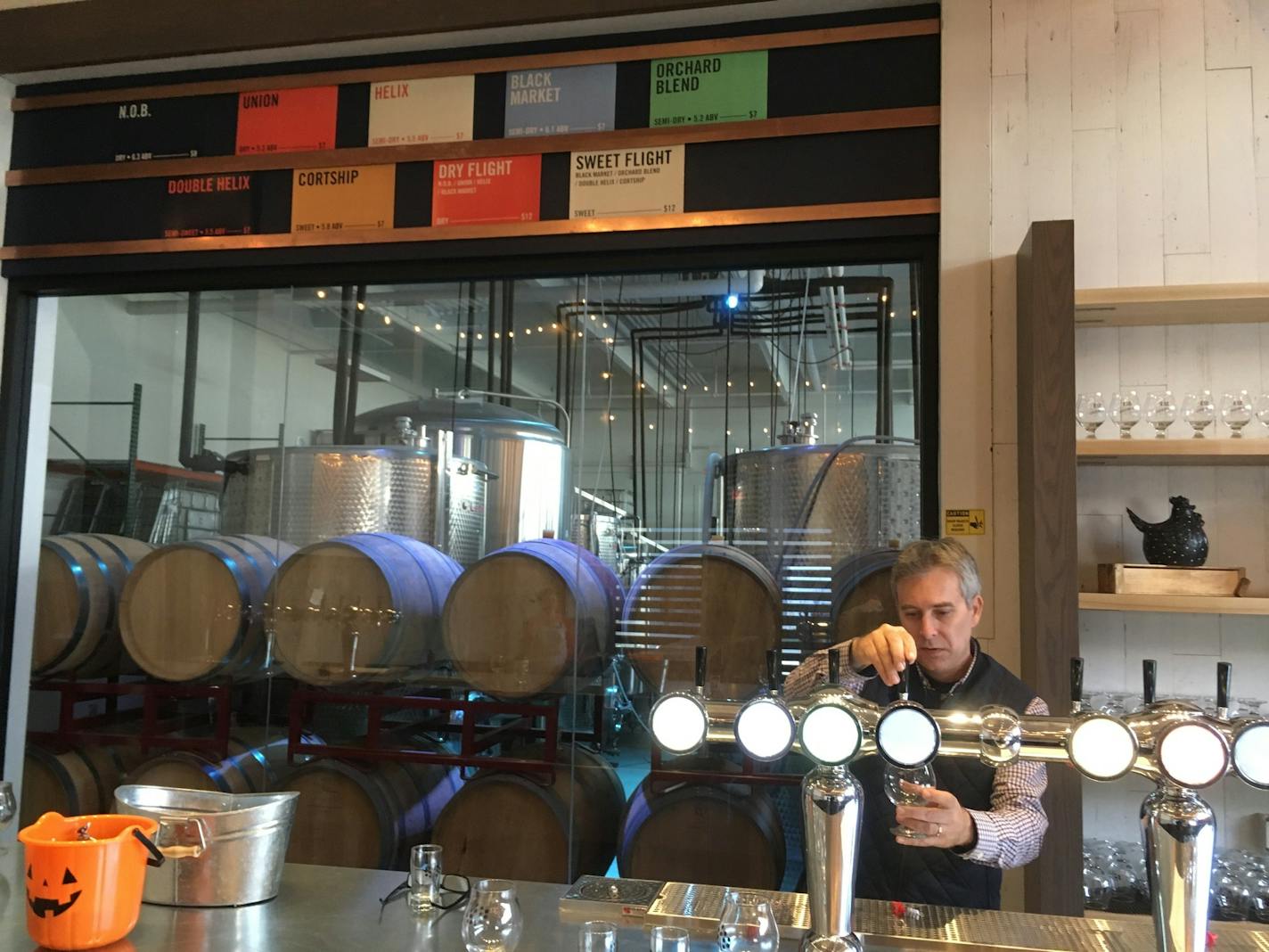 Co-owner Colin Post pours a glass of cider at Number 12 Cider.