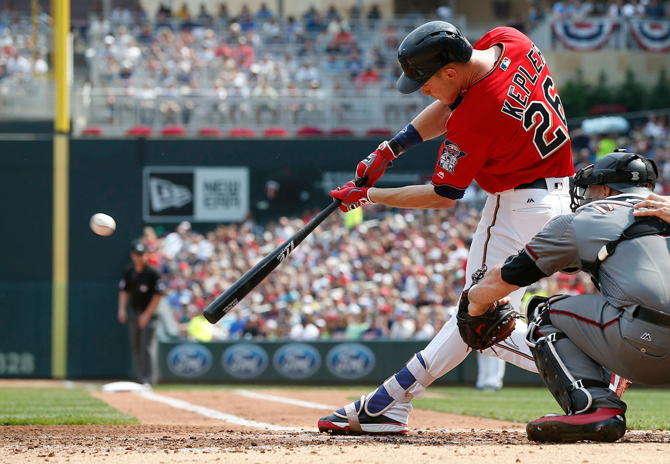 Minnesota Twins' Max Kepler hits a two-run double off Arizona Diamondbacks pitcher T.J. McFarland in the first inning of a baseball game, Sunday, Aug. 20, 2017, in Minneapolis.