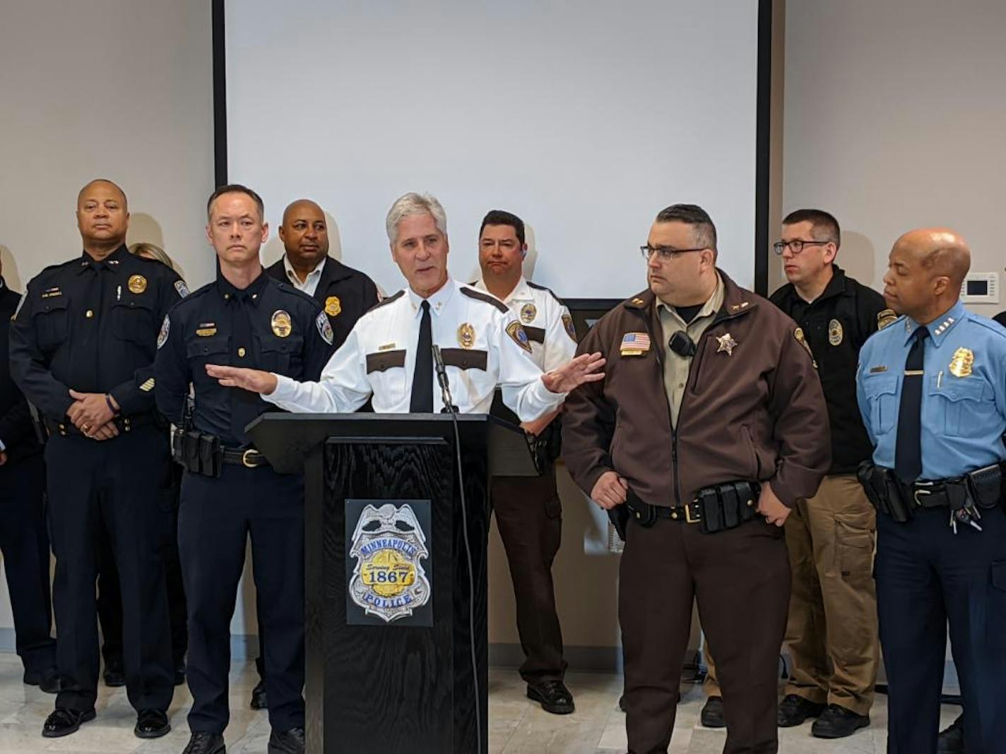 Martin Scheerer, Senior Director of Hennepin EMS, discusses how first responders plan to handle calls to protect themselves and others from the spread of coronavirus. To his right is University of Minnesota Police Chief Matt Clark. To his left are Hennepin County Sheriff Dave Hutchinson and Minneapolis Police Chief Medaria Arradondo. (Photo by Andy Mannix)