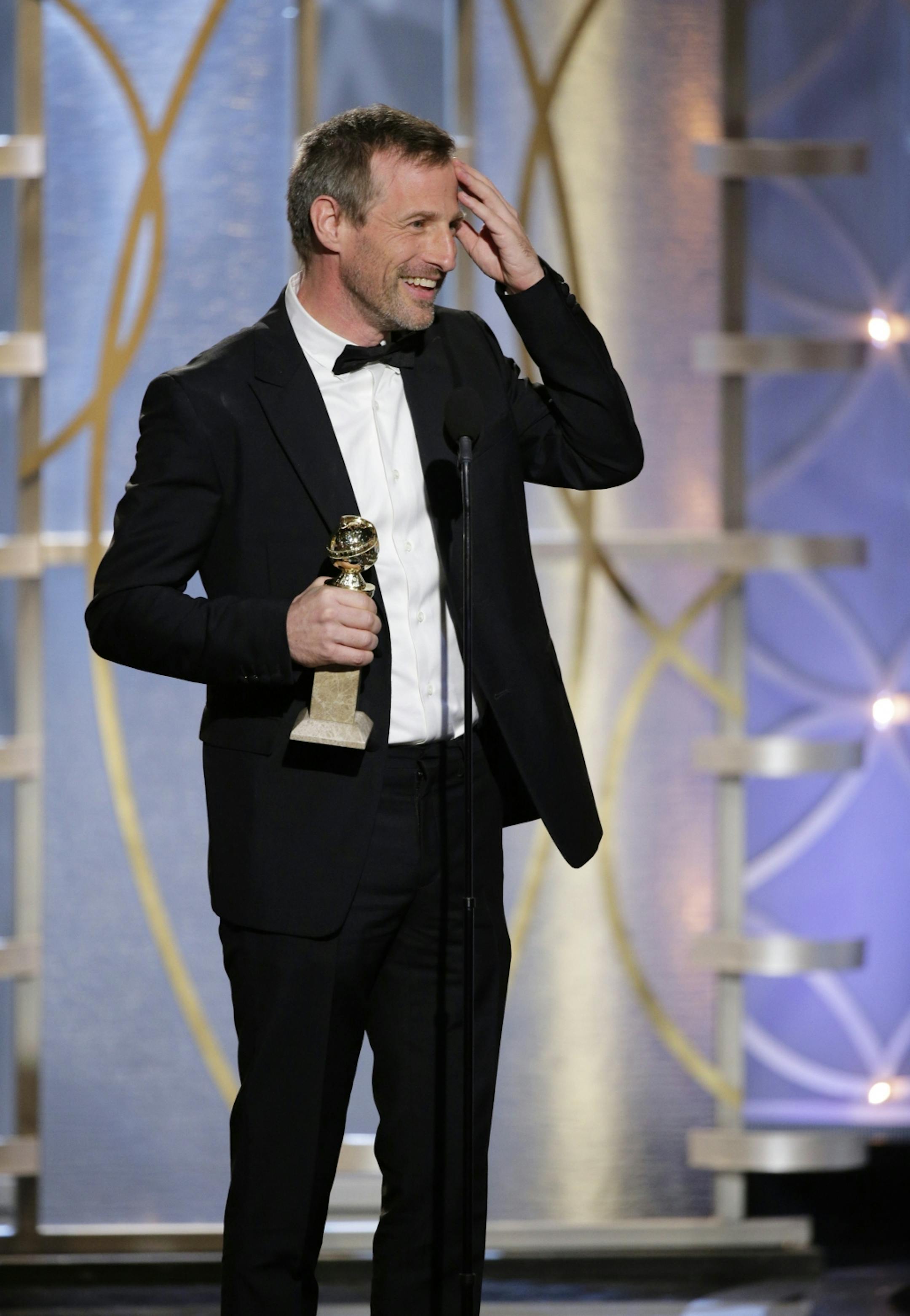 This image released by NBC shows Spike Jonze accepting the award for best screenplay in a motion picture for "Her" during the 71st annual Golden Globe Awards at the Beverly Hilton Hotel on Sunday, Jan. 12, 2014, in Beverly Hills, Calif.