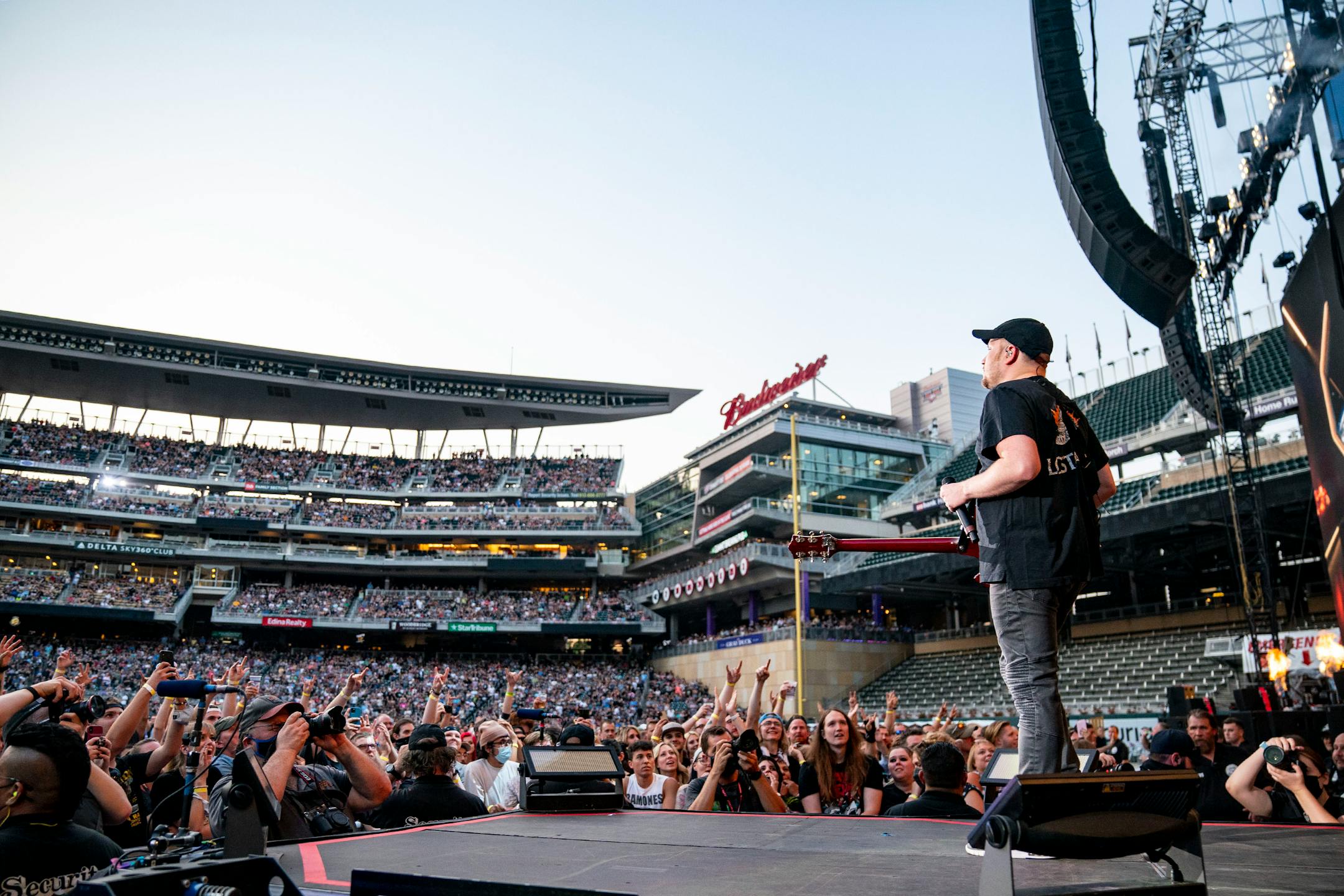Patrick Stump, lead singer of Fall Out Boy, walked down the stage leading to the edge of the pit at the Hella Mega Tour at Target Field in Minneapolis on Monday.