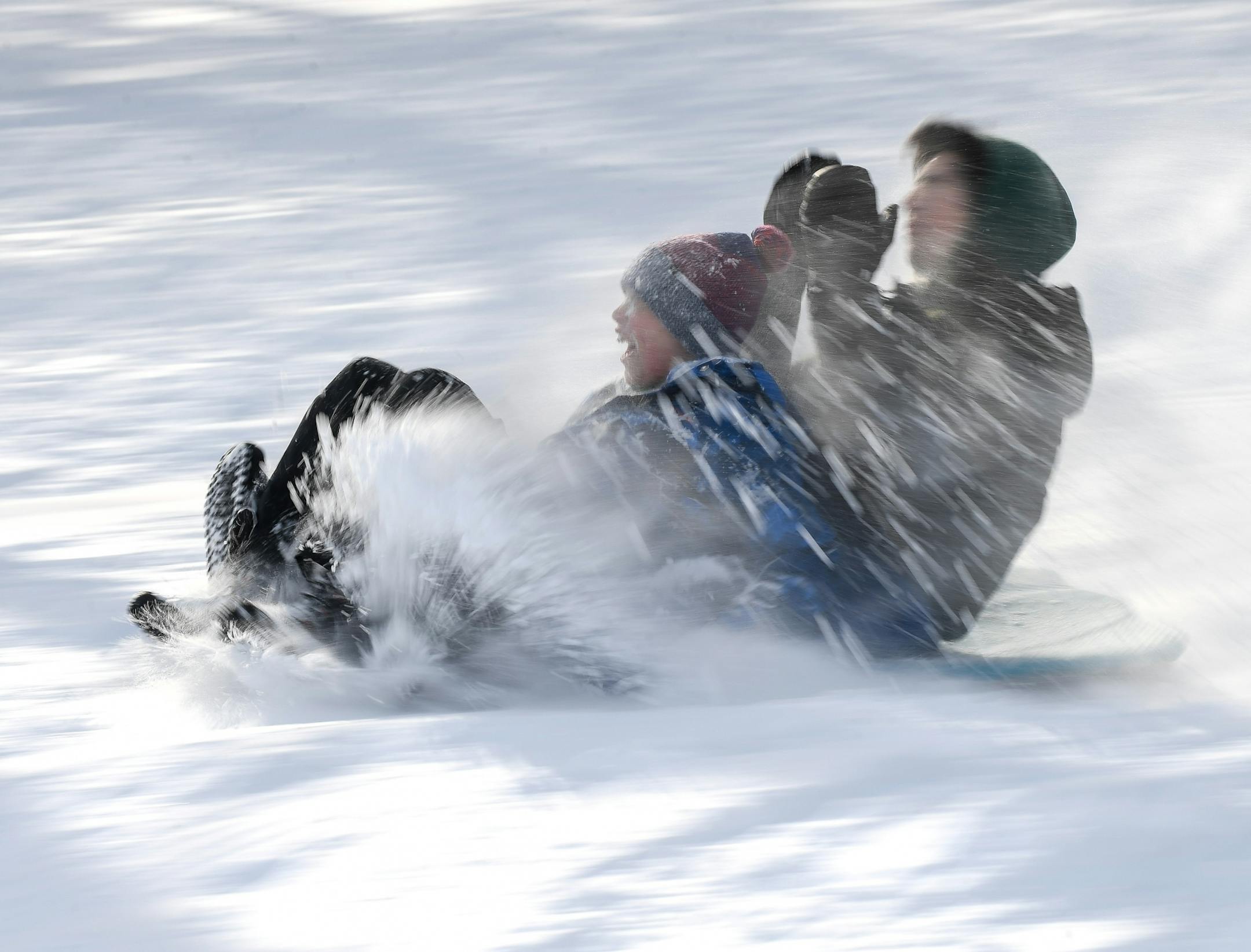 Isaac, left, and Simone, sledded down the hill at Beard's Plaisance Tuesday.