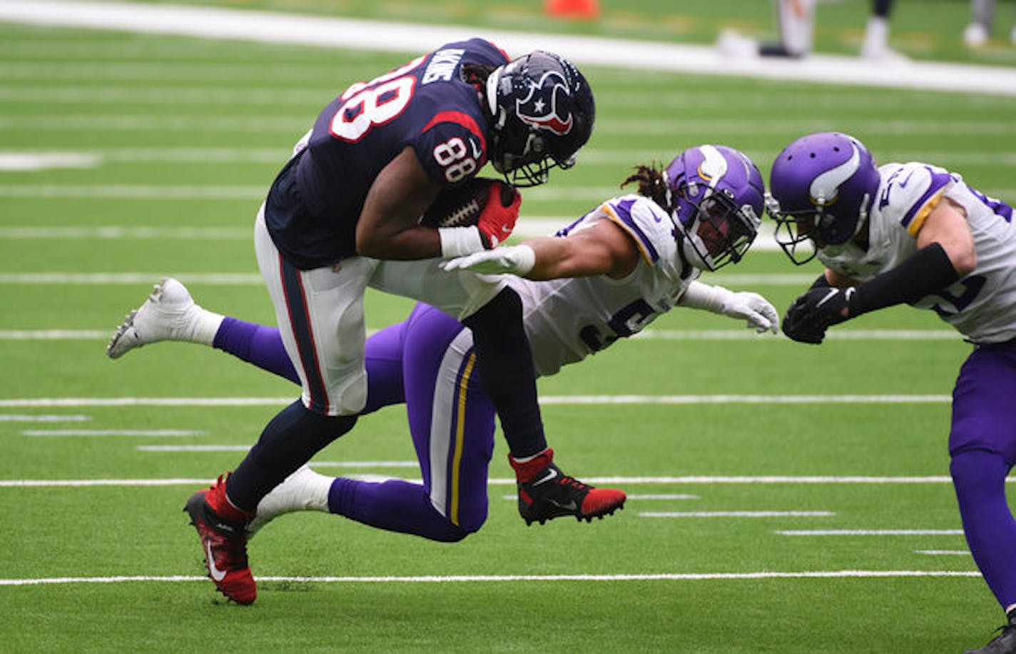 Houston Texans tight end Jordan Akins (88) makes a catch over Minnesota Vikings middle linebacker Eric Kendricks (54) during the first half of an NFL football game Sunday, Oct. 4, 2020, in Houston. (AP Photo/Eric Christian Smith)