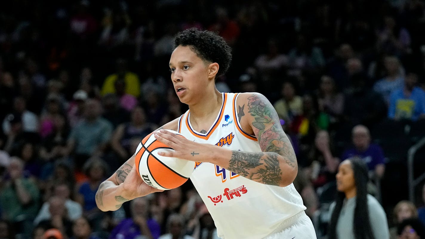 Phoenix Mercury center Brittney Griner grabs a rebound against the Seattle Storm during the first half of a WNBA basketball game Saturday, Aug. 5, 2023, in Phoenix. (AP Photo/Ross D. Franklin)