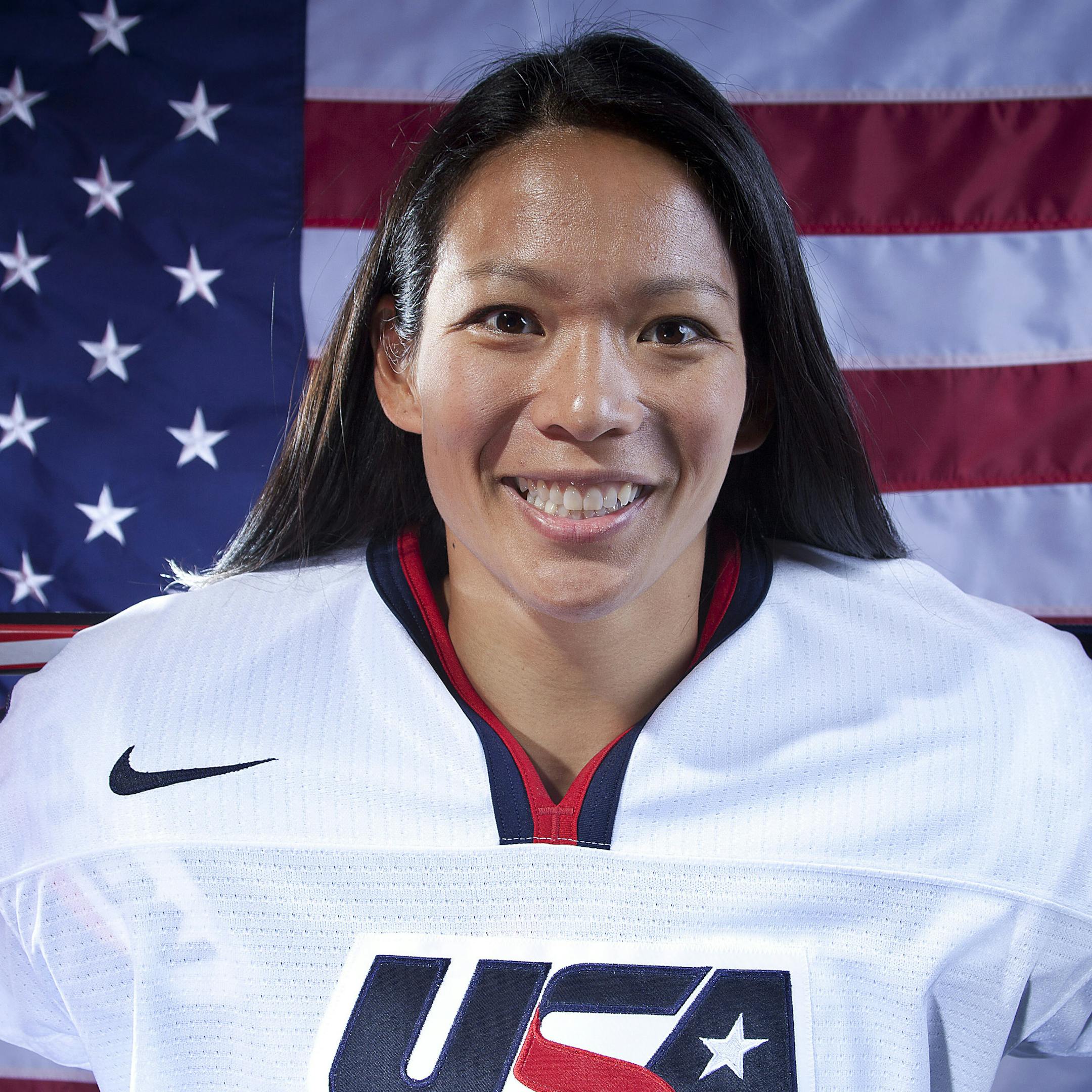 FILE - In this Oct. 2, 2013, file photo, United States women's hockey player Julie Chu poses for a portrait at the 2013 Team USA Media Summit in Park City, Utah. At 31, she's the oldest member of the U.S. team, and she'll be heading to her fourth Olympics in search of her first gold, after already collecting two silvers and a bronze. (AP Photo/Carlo Allegri, File) ORG XMIT: NY181