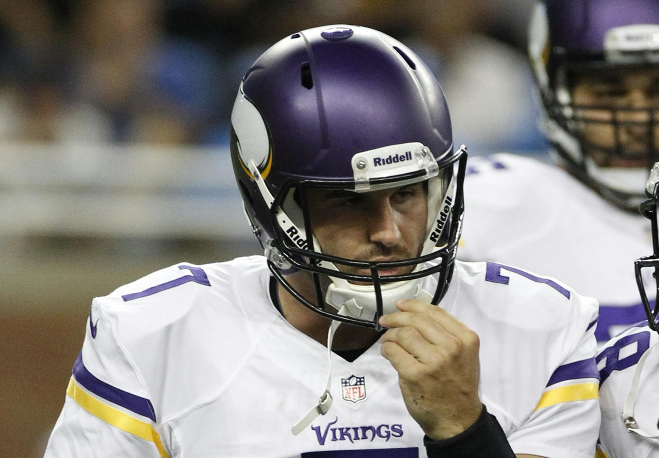 Minnesota Vikings quarterback Christian Ponder heads for the bench during the first quarter of an NFL football game against the Detroit Lions on Sept. 8, 2013.