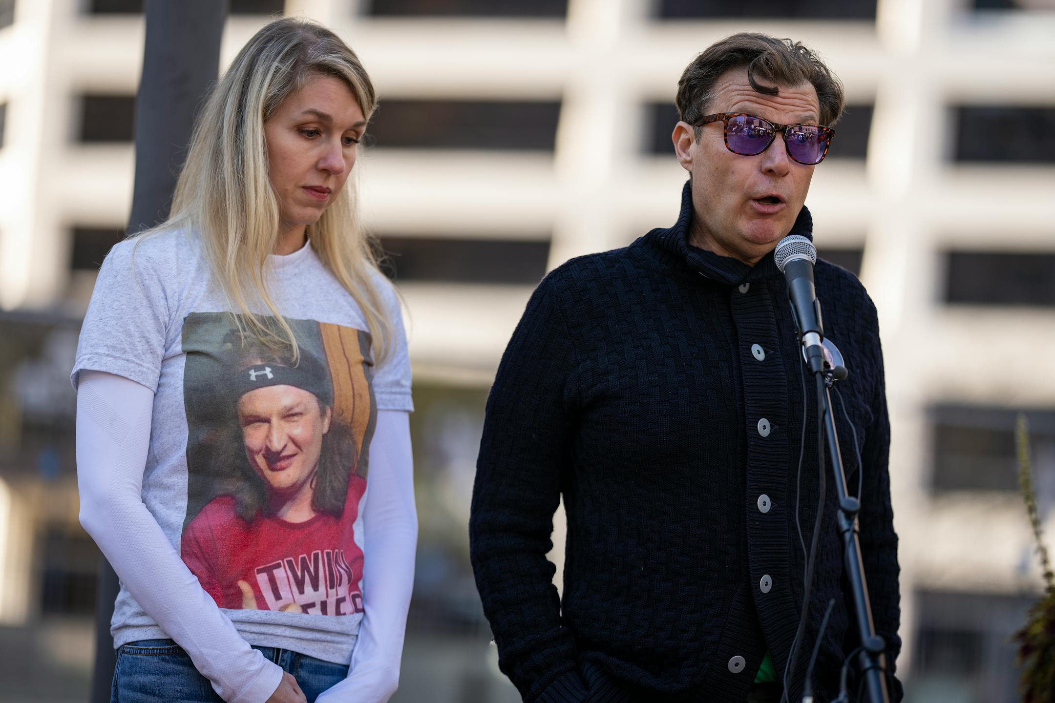 Brian Markey, right, the brother of Stephen Markey, and Kristin Derus Dore, their cousin, spoke during a rally in protest of Hennepin County Attorney Mary Moriarty outside the Hennepin County Government Center. Stephen Markey was killed during a carjacking in 2019.