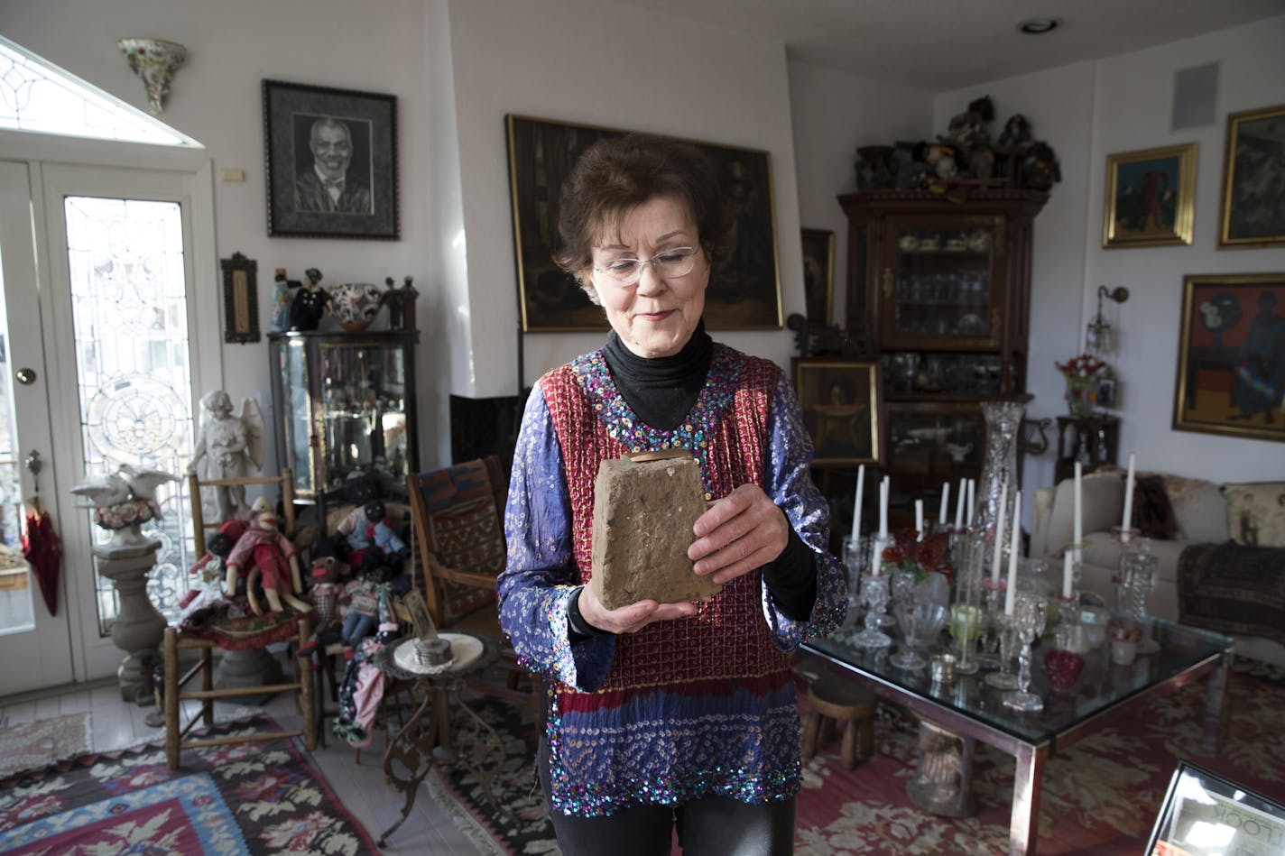 Diane Page held a White House brick made by slaves that is part of her and her husband Alan Page's collection of African American art, antiques and artifacts that may be included in an exhibit called &#x201c;Testify: Americana from Slavery to Today" that opens January 8 for a month at The Hennepin County Library. Photographed on Tuesday, December 19, 2017, in Minneapolis, Minn. ] RENEE JONES SCHNEIDER &#x2022; renee.jones@startribune.com