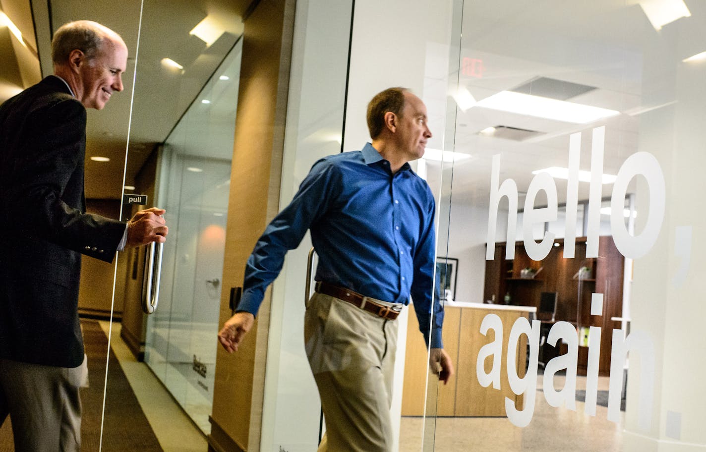 Atmosphere CEO Mike Litwin walked into the company's office. Atmosphere is the rebranded Target Commercial Interiors. Behind him is Steelcase CEO Jim Keane. The Hello Again in the company's front window is new as they reintroduce themselves. ] GLEN STUBBE * gstubbe@startribune.com Wednesday, July 8, 2015 L to R, Target Commerical Interiors, the office furniture business Target Corp. sold in May, is unveiling its new name and look. And it's not red. Rather, it's blue and the new name is Atmospher