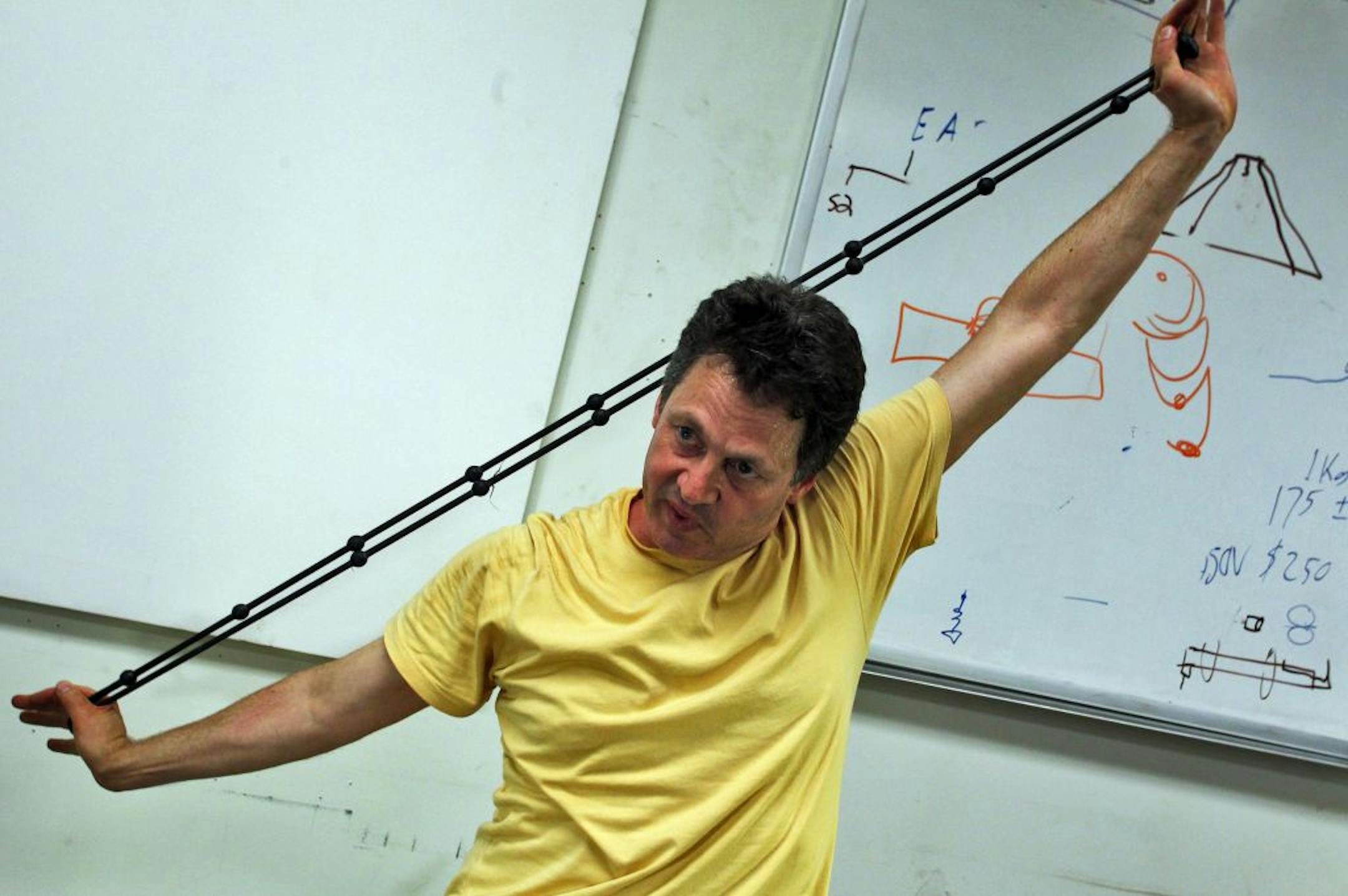 Nick Musachio is an inventor working out of a Minneapolis warehouse called the Hack Factory. He invented an exercise device called the Kefty Home Gymn that is a use-anywhere exerciser with PVC tubing and rubber stretch cords. He is also developing a microprocessor that reads off GPS units in cars to steady the flow of traffic through city traffic lights. Here Musachio demonstrated one of the exercises performed with the cords of the Kefty Home Gymn. (MARLIN LEVISON/STARTRIBUNE(mlevison@startribu