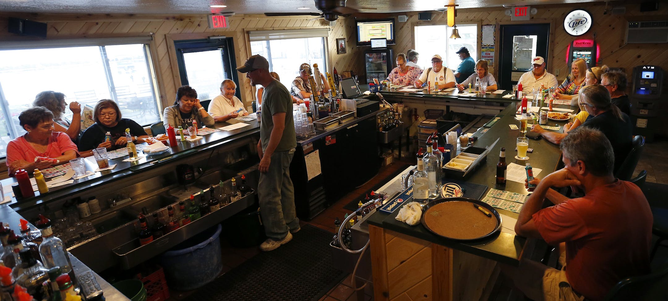 A large crowd gathered at the bar at Nitti’s Hunters Point Resort in Isle, Minn., for bingo night on Tuesday. George Nitti owner of Nitti’s Hunters Point Resort fears a ban on walleye would be devastating to his businesses.