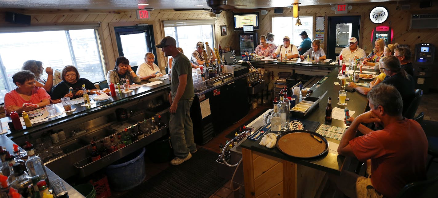 A large crowd gathered at the bar at Nitti&#x2019;s Hunters Point Resort in Isle, Minn., for bingo night on Tuesday. George Nitti owner of Nitti&#x2019;s Hunters Point Resort fears a ban on walleye would be devastating to his businesses.