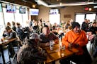 Patrons packed every table at Alibi Drinkery in Lakeville, Minn., Wednesday, Dec. 16, 2020. Monet Zarza, owner of Alibi Drinkery in Lakeville, is part