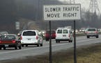 GENERAL INFORMATION: Minnetonka,Mn. 4/10/2002 WILL GO FROM HOME -- Story is about the slow traffic move right signs that went up in the summer of 2000