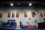 Gophers freshman Kellen Ryan dismounts from the high bar during practice Monday, April 25, 2022 at Cooke Hall in Minneapolis, Minn.. One season after 