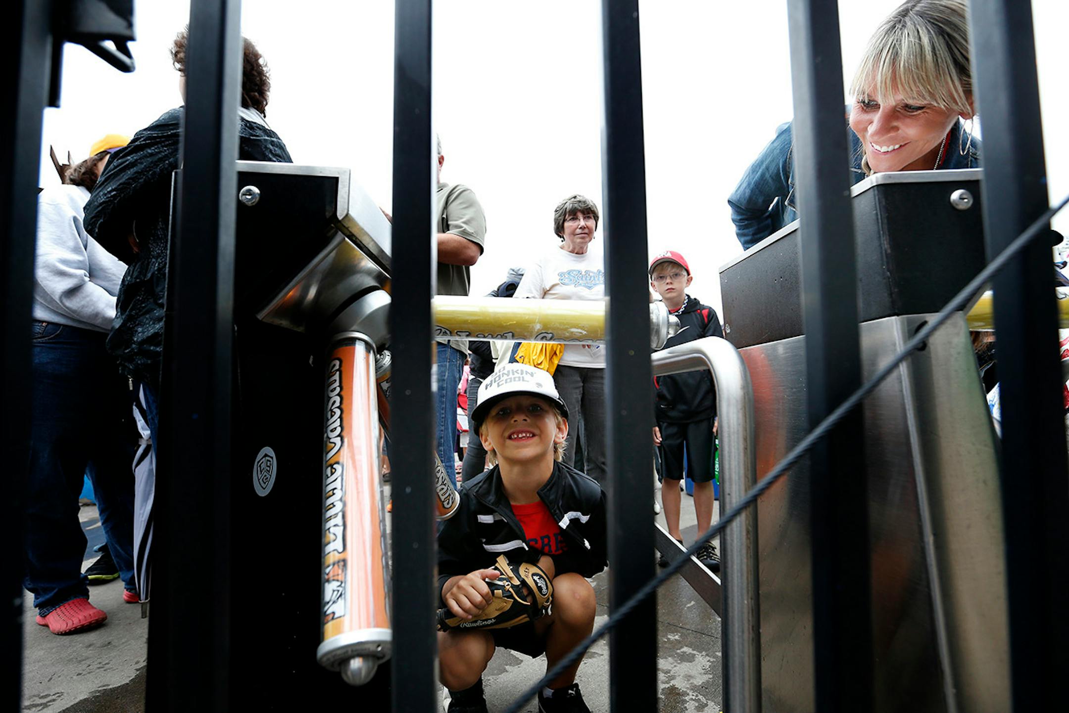 Alex Leibel, 5, of St. Paul and his mother Tracey were the first in line to get into the St. Paul Saints final game at Midway Stadium on Thursday night. ] CARLOS GONZALEZ cgonzalez@startribune.com - August 28, 2014, St. Paul, Minn., Midway Stadium, St. Paul Saints baseball vs. Winnipeg - Final Saints game at Midway Stadium