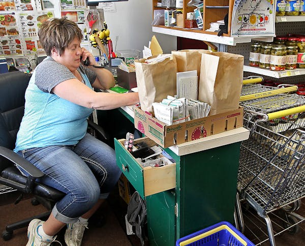 Bonnie Carlson took a phone order at her grocery store.