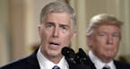 Supreme Court nominee Judge Neil M. Gorsuch speaks as President Donald Trump looks on in the East Room of the of White House in Washington, D.C., on T